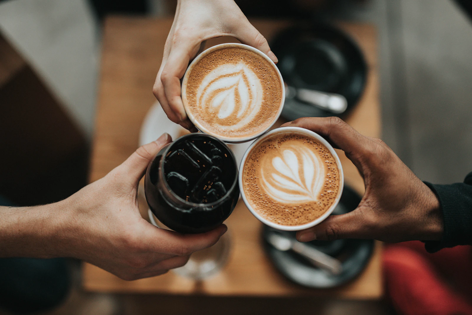 Filipino barista pulling espresso at a small café counter